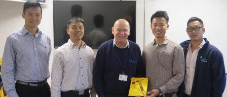 A group photo of DDRC Healthcare's Operations Director, Pete Arkey, with members of the Hong Kong Fire Service