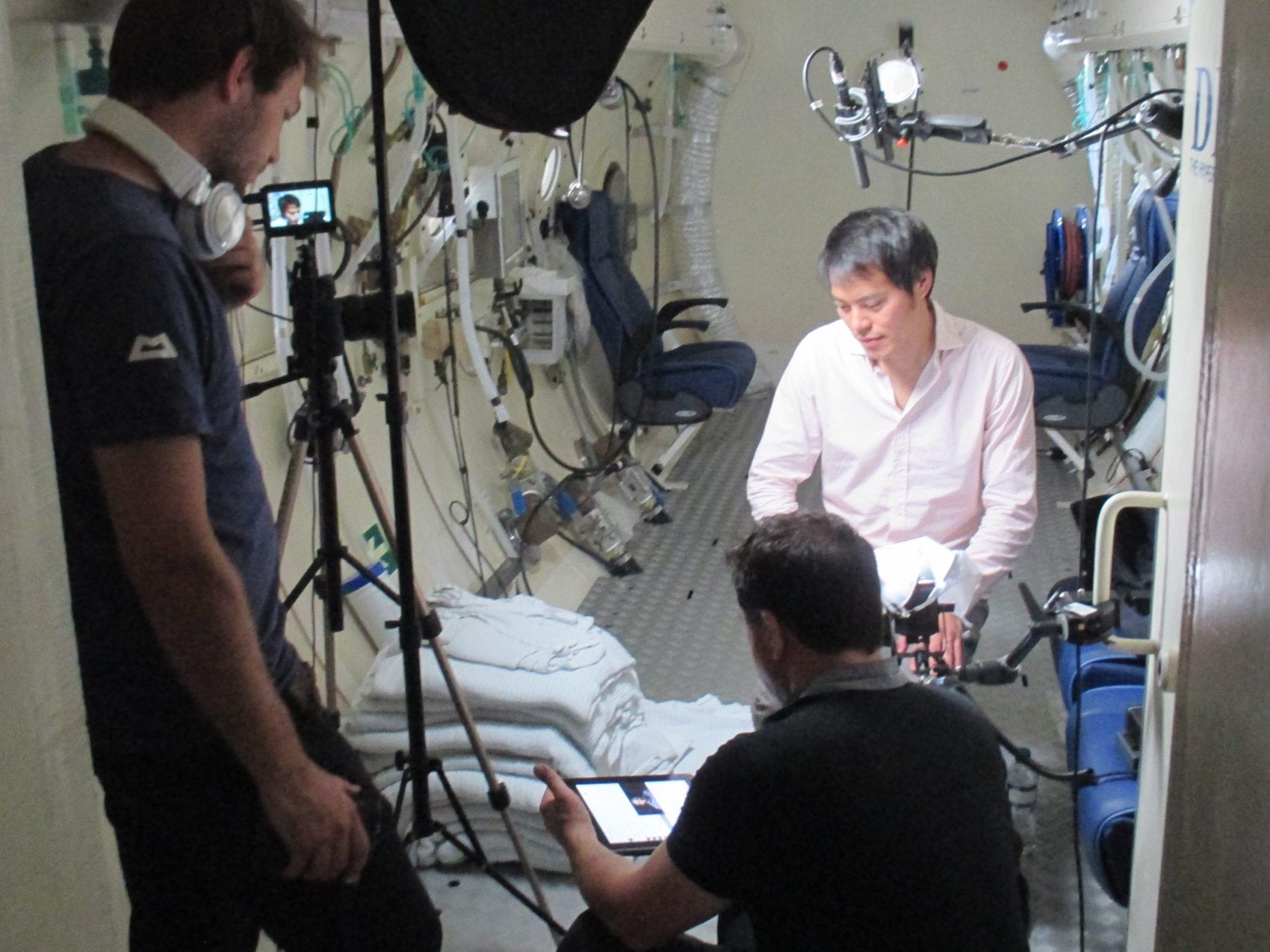 Dr Kevin Fong filming inside a hyperbaric chamber at DDRC Healthcare