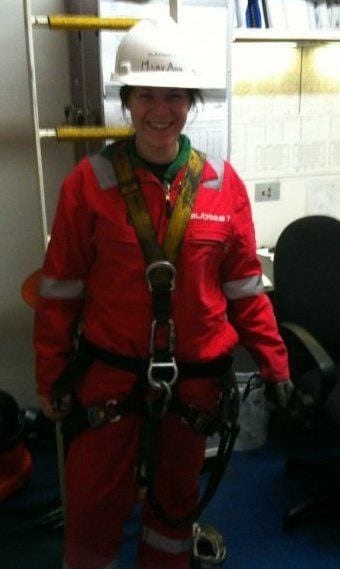 Mary Ann Forster in a hard hat overalls and harness