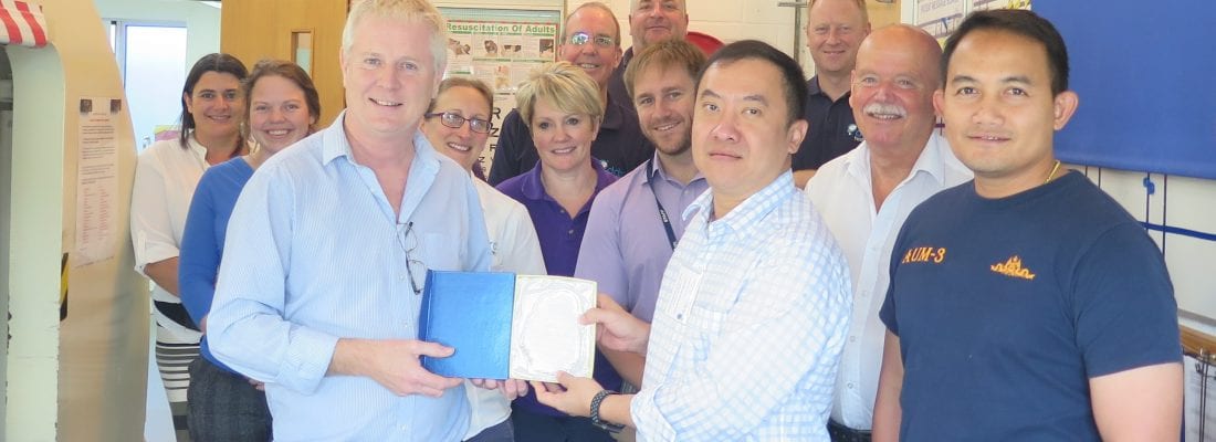 Dr Gary Smerdon presenting a gift to Royal Thai Navy attending the Safety Manager Course