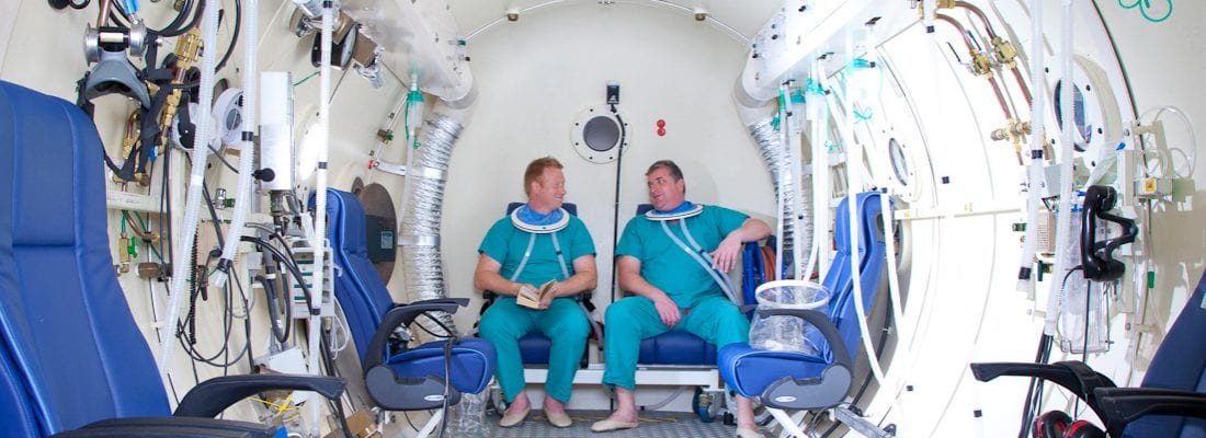 DDRC staff modelling as patients in the hyperbaric chamber